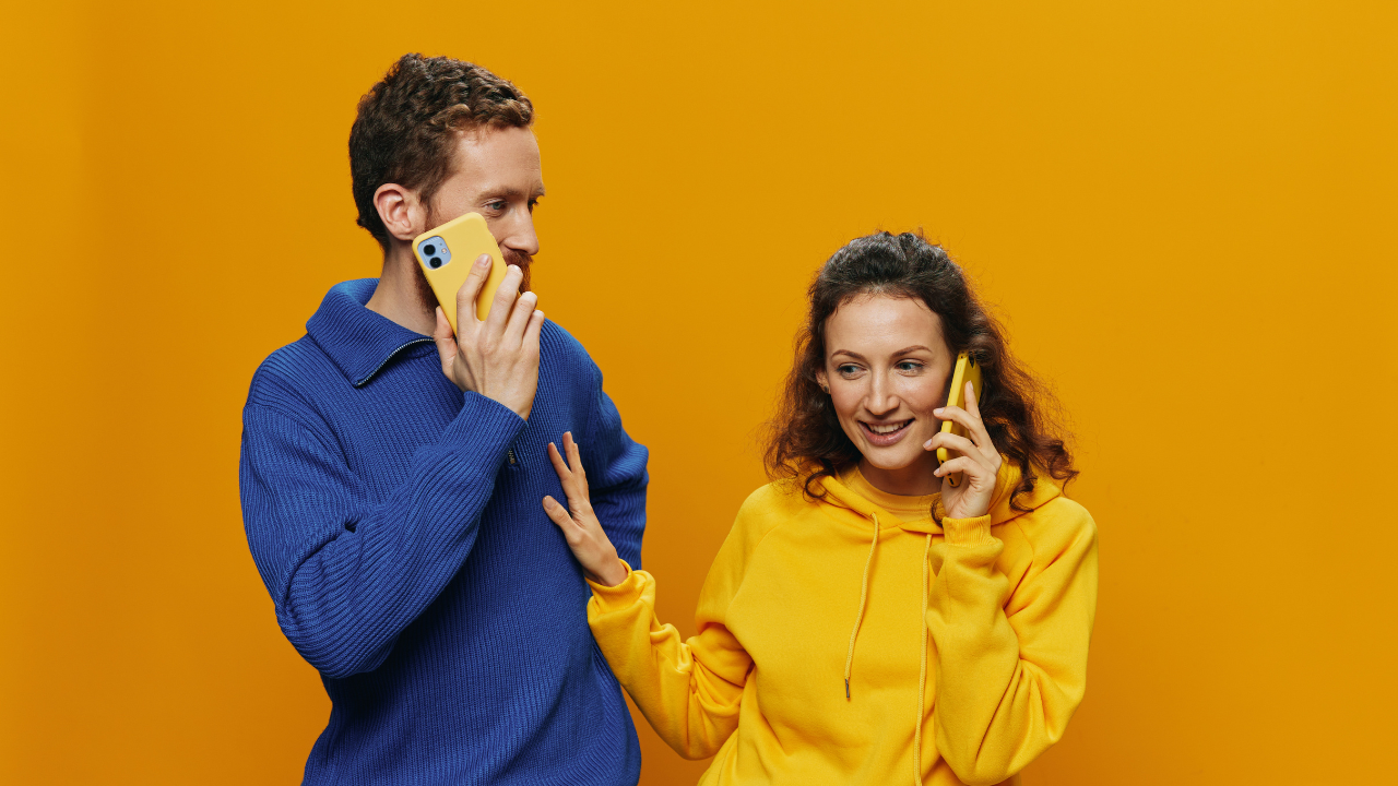 Couple using their phones to communicate, representing staying connected through technology